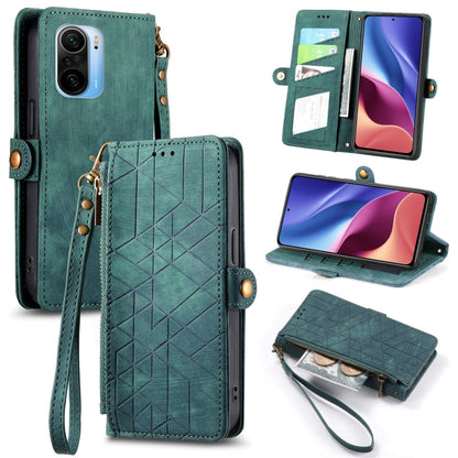 Teal leather phone case wallet with geometric pattern, zipper, and wrist strap