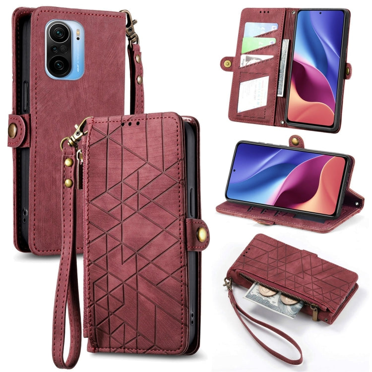 Burgundy leather phone case wallet with geometric pattern, zipper, and wrist strap