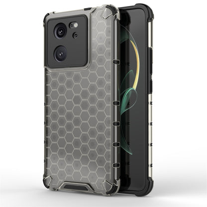 Black shockproof honeycomb phone case with raised edges and hex texture.