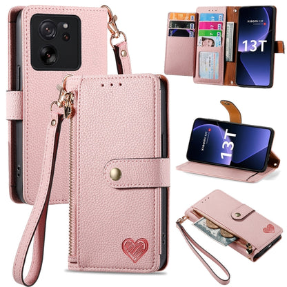 Pink leather wallet phone case with zipper card holder, wrist strap, and fold-out stand