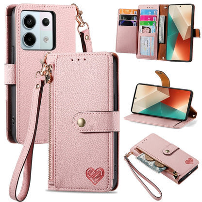 Pink leather wallet phone case with zipper card holder, wrist strap, and fold-out stand