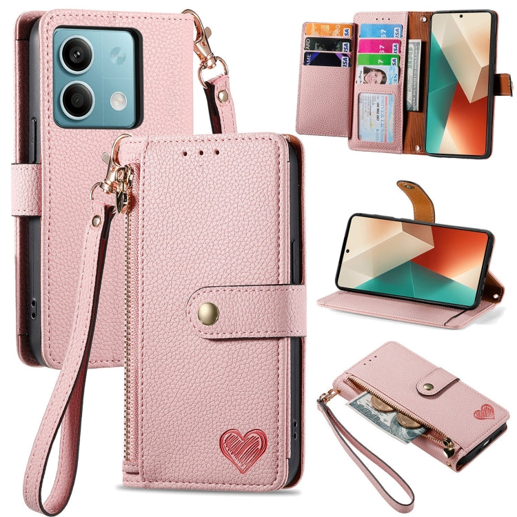 Light pink leather-style phone wallet case with zipper, lanyard strap, and heart emblem