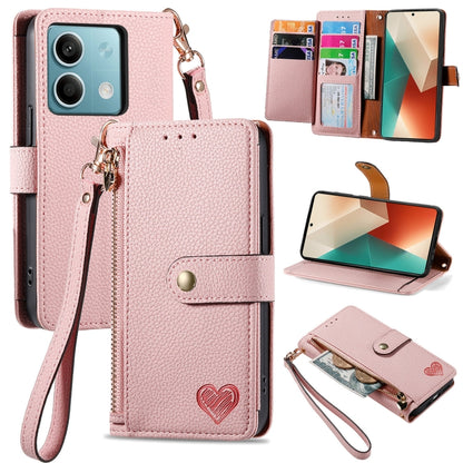 Light pink leather-style phone wallet case with zipper, lanyard strap, and heart emblem