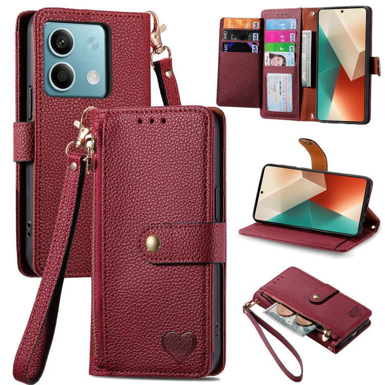 Dark red leather-style phone wallet case with zipper, lanyard strap, and heart emblem