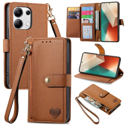 Brown leather phone case with wrist lanyard, card slots, heart strap detail, stand view