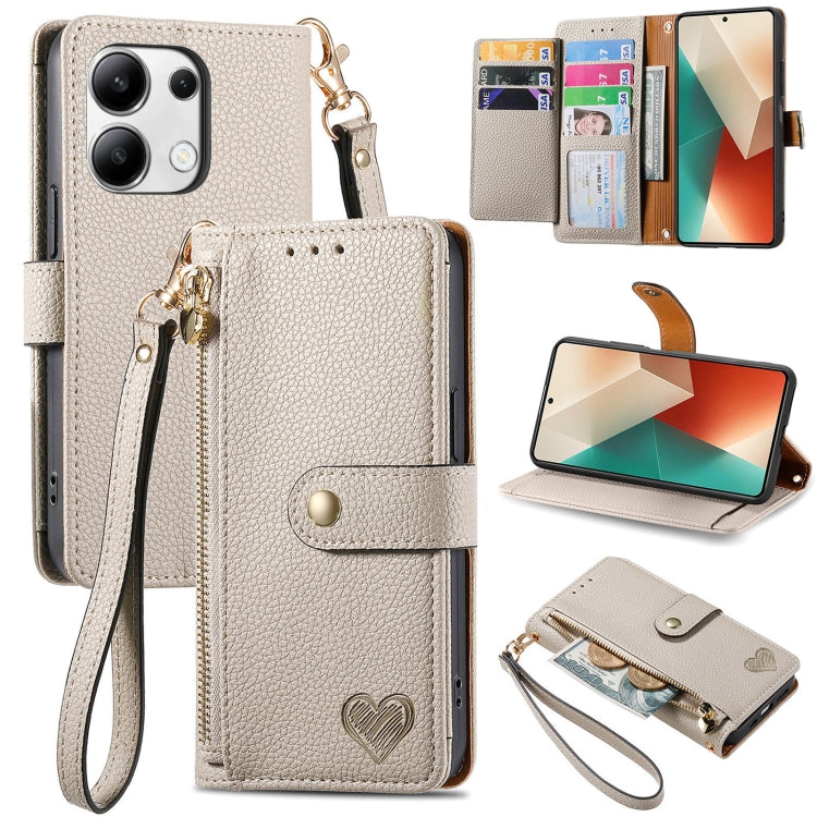 Cream leather phone case with wrist lanyard, card slots, heart strap detail, stand view
