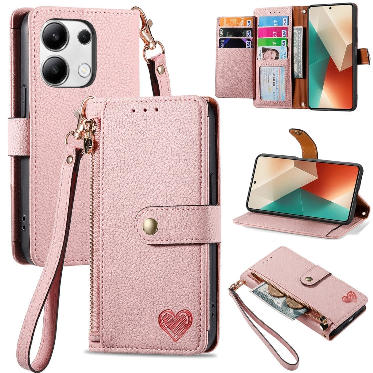 Pink leather phone case with wrist lanyard, card slots, heart strap detail, stand view