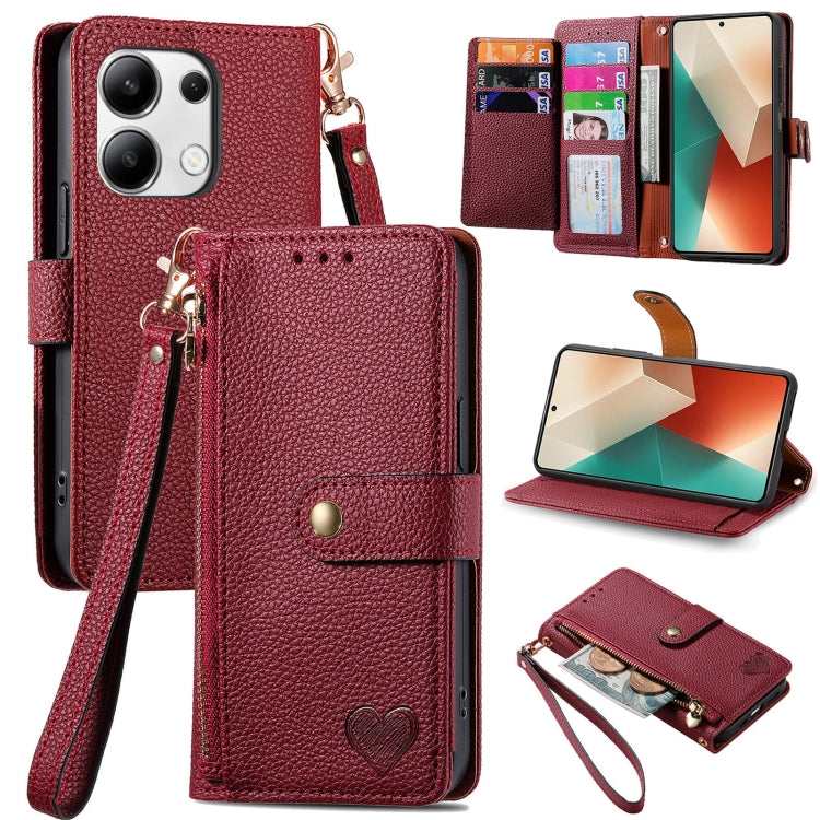 Burgundy leather phone case with wrist lanyard, card slots, heart strap detail, stand view