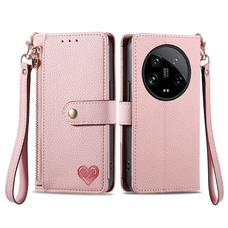 Pink leather-style phone case with zipper, lanyard strap, and heart emblem front flap