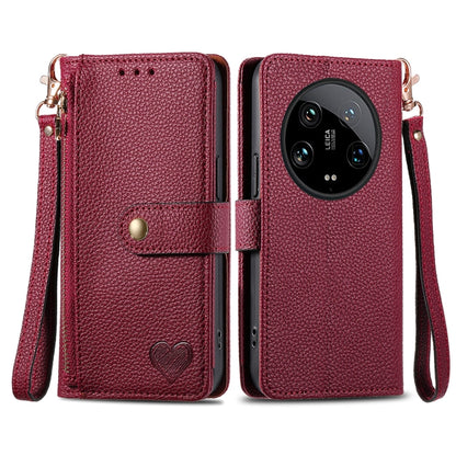 Burgundy leather-style phone case with zipper, lanyard strap, and heart emblem front flap
