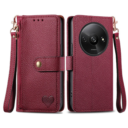 Dark red leather phone case with wrist lanyard, zipper, and card pocket window, heart emblem
