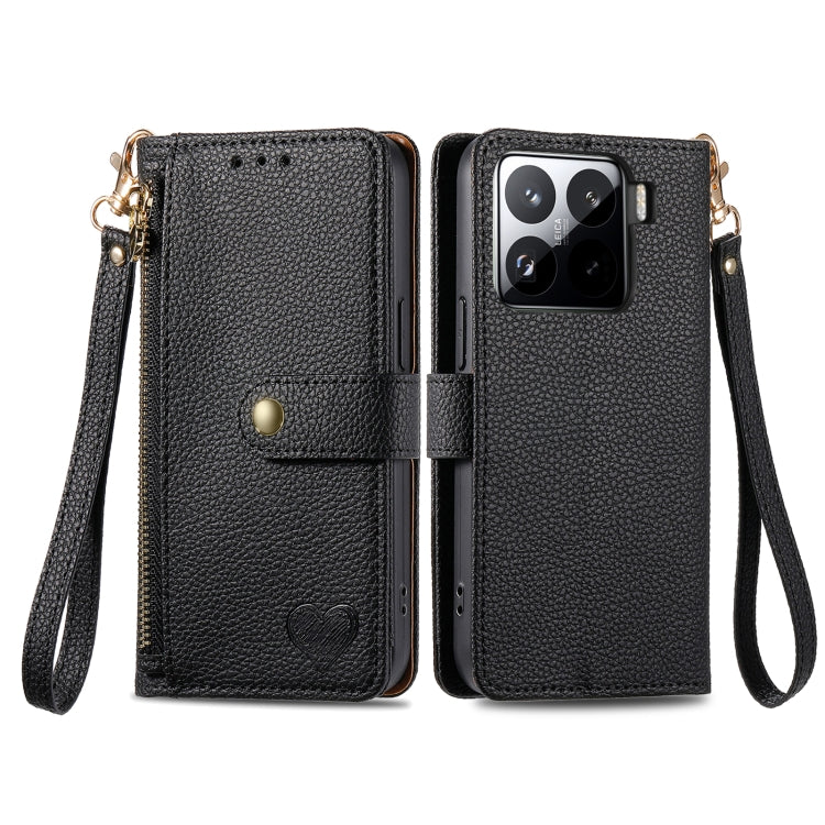 Black leather phone case with wrist strap, card holder, and heart detail