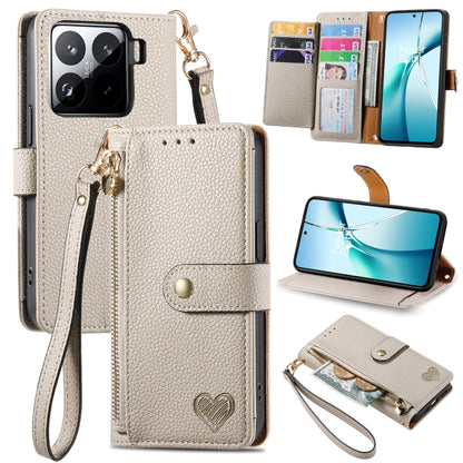 Beige leather phone case with wrist strap, card slots, and heart emblem