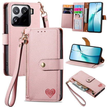 Pink leather phone case with wrist strap, card slots, and heart emblem