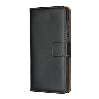 Black leather vertical flip holster wallet with magnetic clasp strap detail.