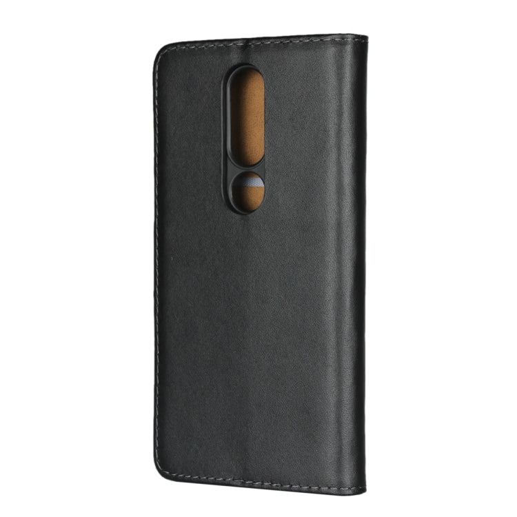 Black leather phone holster with dual camera cutout on the flip cover.