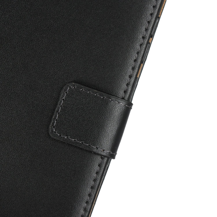 Black leather flip holster with stitched strap tab and reinforced edge.