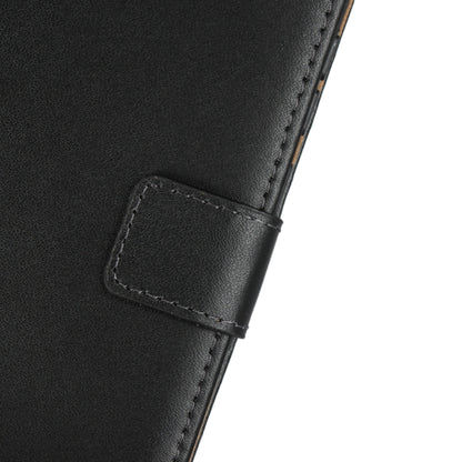Black leather flip holster with stitched strap tab and reinforced edge.