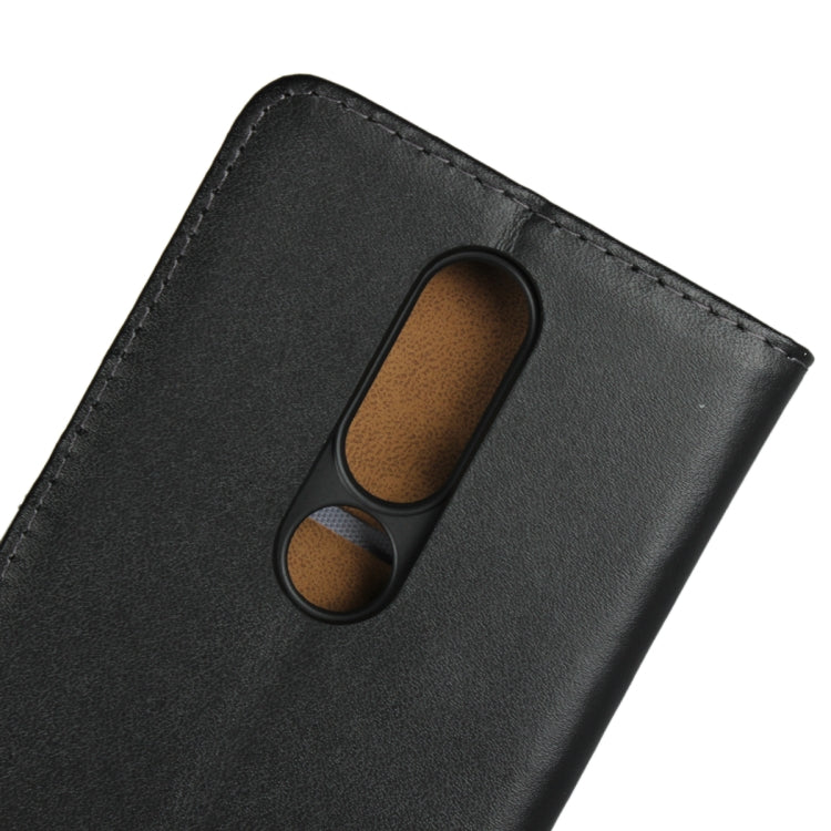 Black leather flip holster with dual camera opening and textured interior.