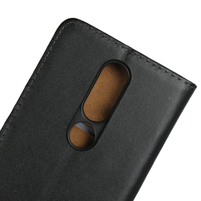 Black leather flip holster with dual camera opening and textured interior.