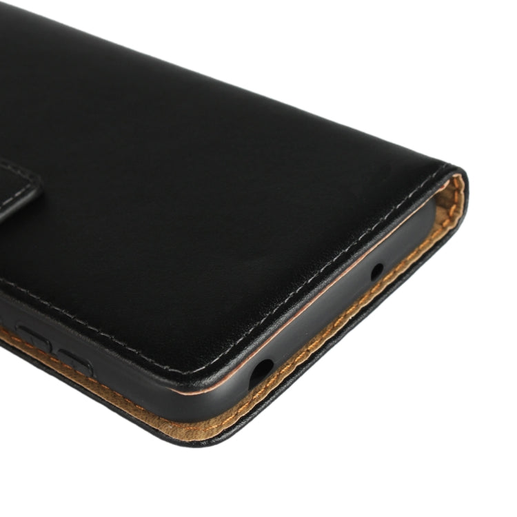 Leather flip holster corner with contrast stitching and brown underside trim.