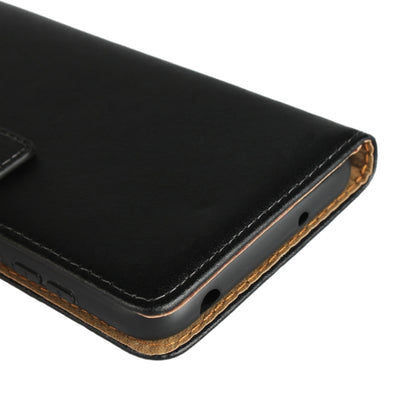 Leather flip holster corner with contrast stitching and brown underside trim.