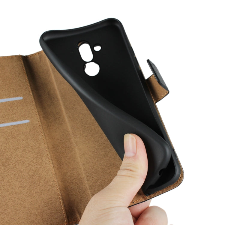Black leather flip holster wallet for Huawei Mate 20 Lite, with phone camera cutout.