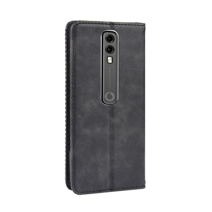 Black flip leather phone case with camera cutout on the back and stitched edges