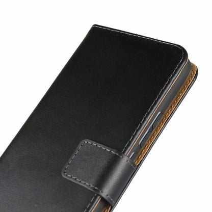 Black leather flip holster corner view with front flap strap and visible phone edge