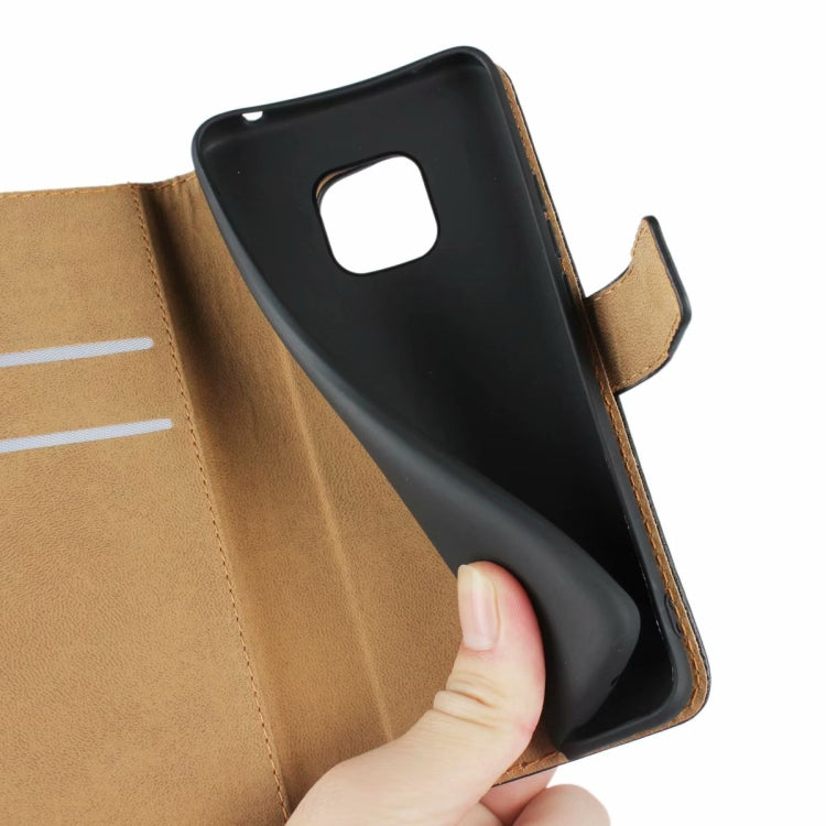 Leather flip holster with tan interior and phone backing inserted into front cover
