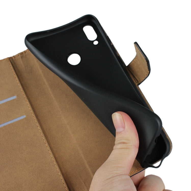Black leather flip phone wallet holster with phone inserted and open side flap