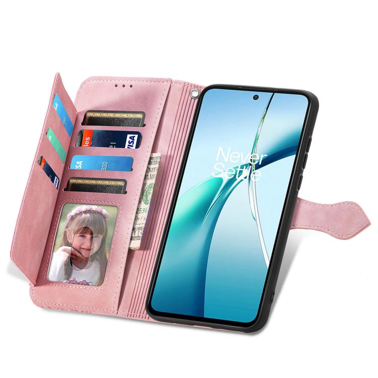 Pink leather wallet phone case with zipper, card slots, and viewing window