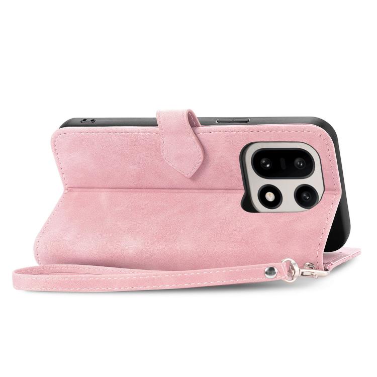 Pink leather folio phone case with magnetic clasp, zipper pocket, and wrist strap