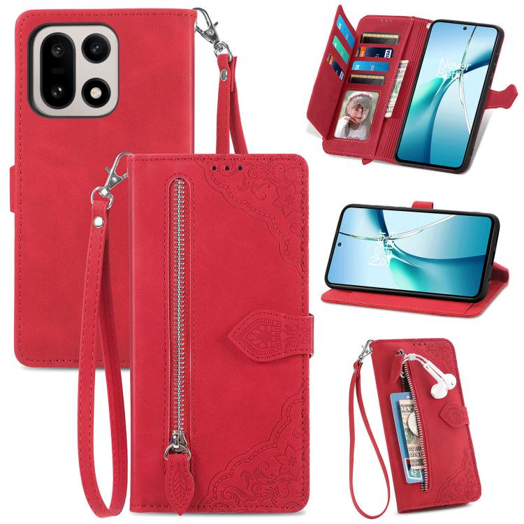 Red leather phone case with embossed floral pattern, front zipper, and wrist strap