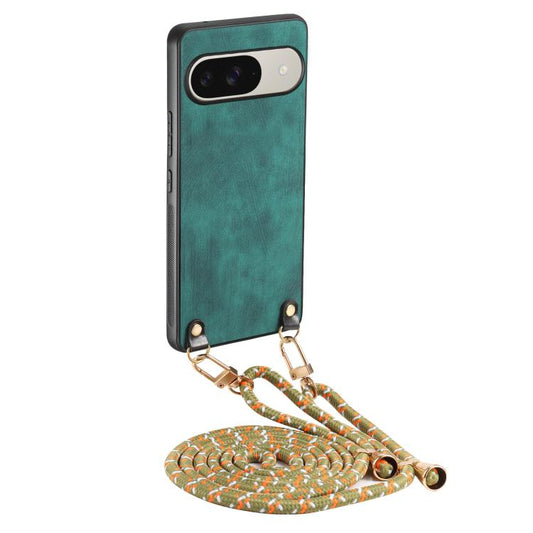 Green vintage leather phone case with crossbody strap and patterned coiled lanyard