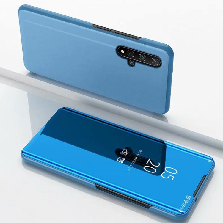 Blue mirror flip leather case with holder, closed back and open front view.