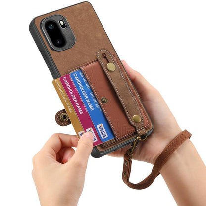 Brown phone wallet case with card cards visible and wrist lanyard loop