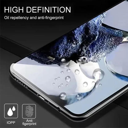 Tempered glass screen protector with oil-repellent and anti-fingerprint coating, droplets shown