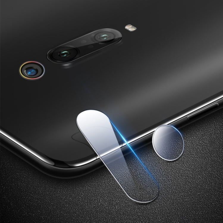 Curved rear camera lens tempered glass film protecting rear camera openings on a phone