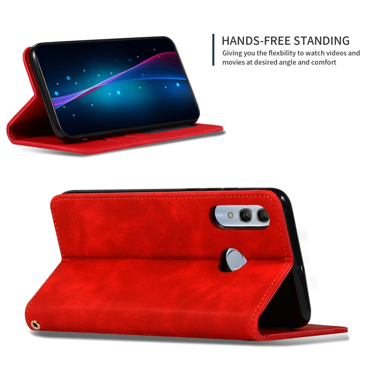 Red leather magnetic flip wallet phone case in standing view for hands-free use.