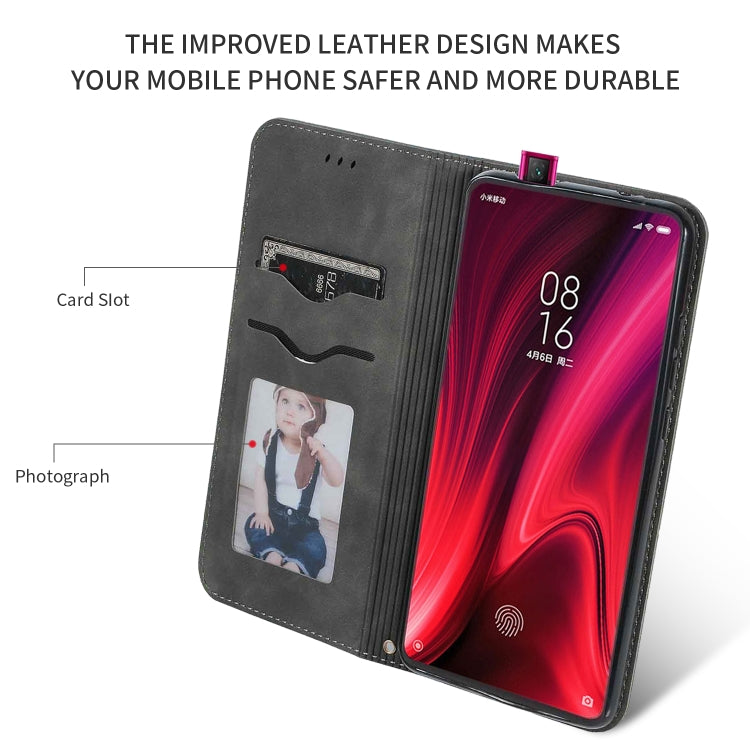 Dark gray flip wallet phone case with card slot and window pocket; phone in cover.