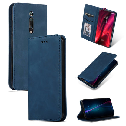 Navy blue magnetic flip wallet phone case with stitched edges and side camera cutout.
