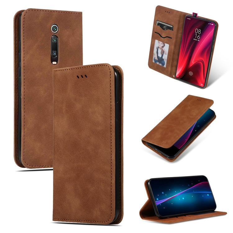 Brown magnetic flip wallet phone case with stitched edges and camera cutout; open view.