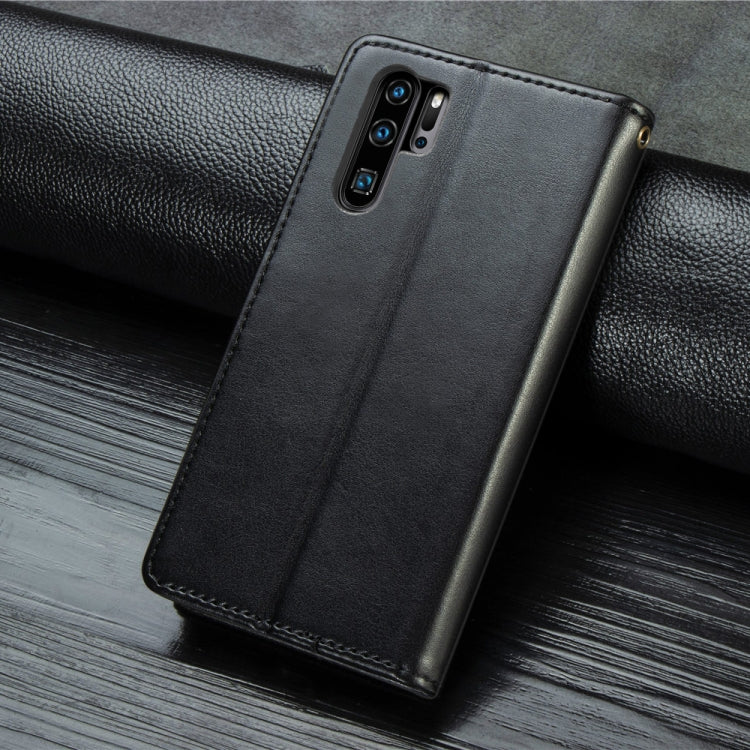 Black leather wallet phone case with camera cutouts and stitched edges