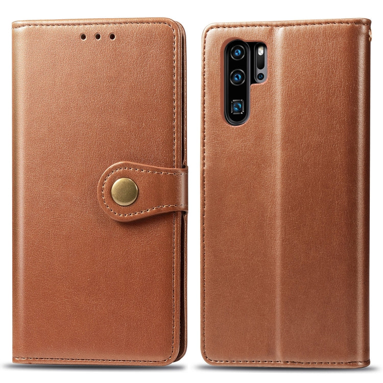 Tan leather phone wallet case with circular snap button and dual card slots