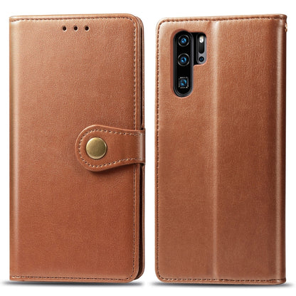 Tan leather phone wallet case with circular snap button and dual card slots