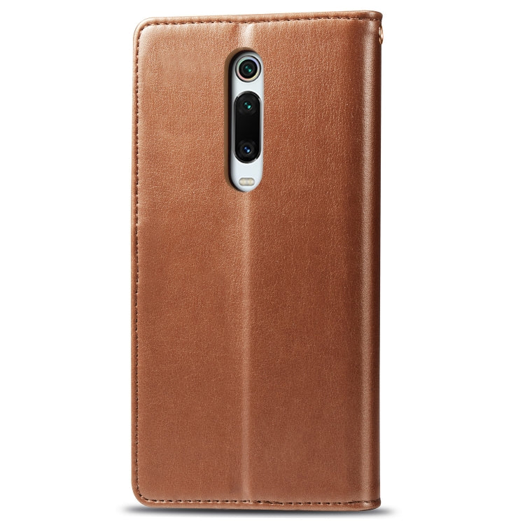 Brown leather flip phone case with camera cutout and stitched edges