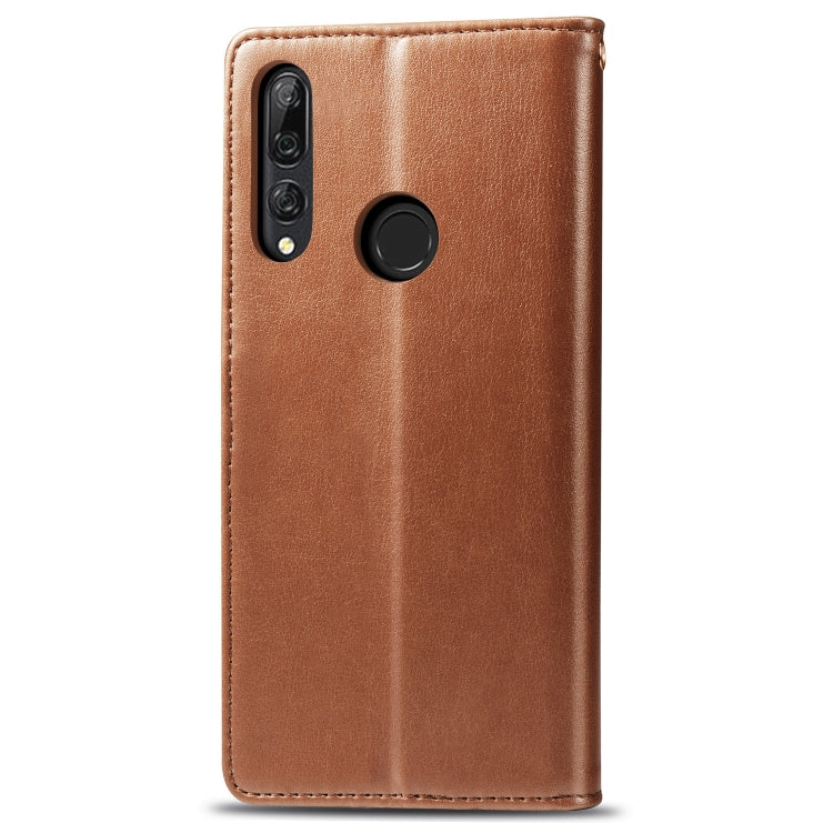 Brown leather phone case with camera cutouts and round button detail