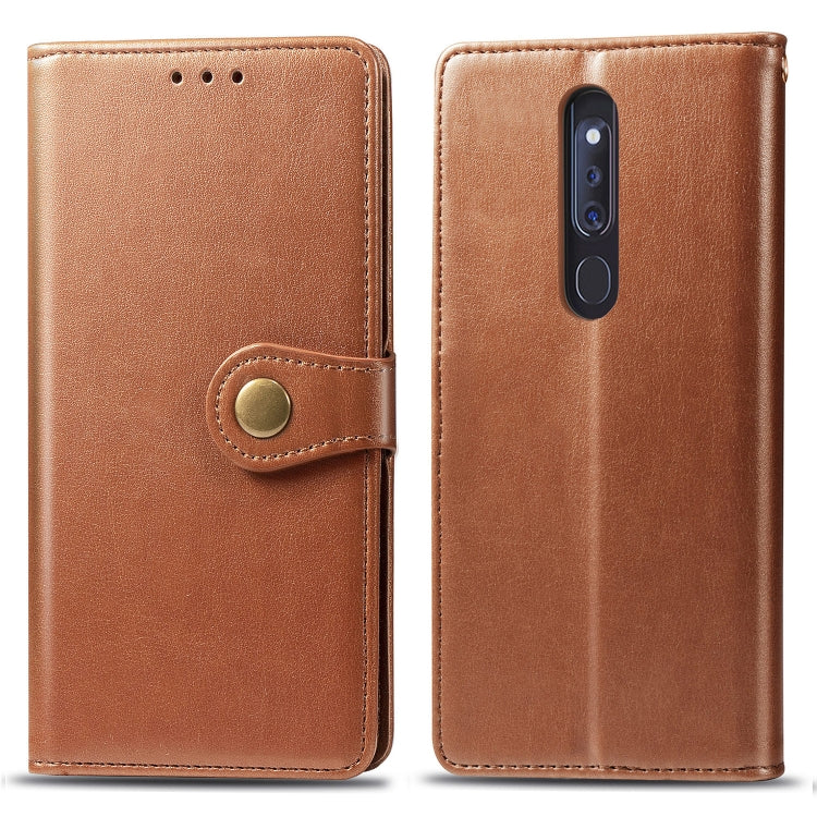 Brown leather flip phone case with magnetic clasp, side button strap, and card slot
