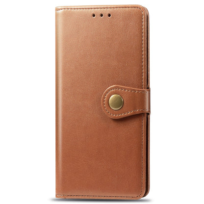 Tan leather wallet phone case with magnetic clasp and circular button fastener